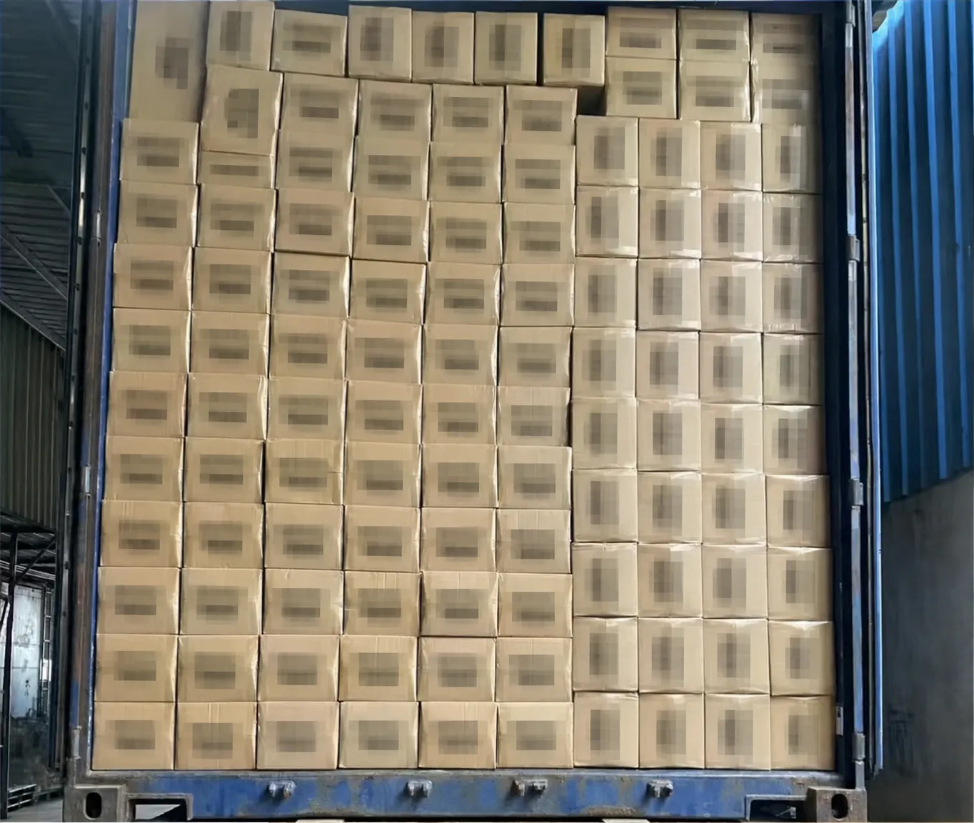 Foodservice packaging cartons inside export container with brands redacted