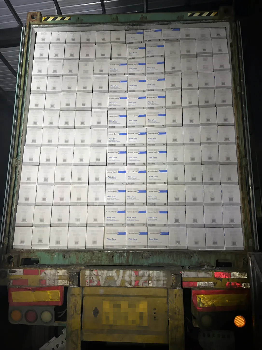 Private label food packaging cartons in container with identifiers redacted