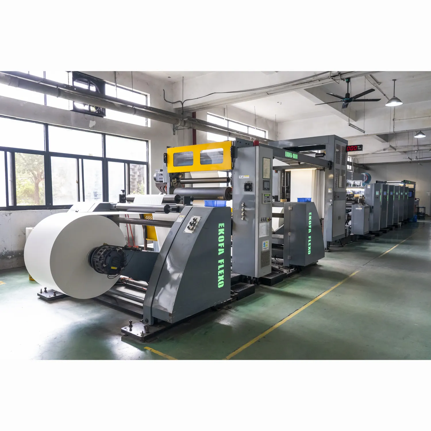 Paper web printing and converting line