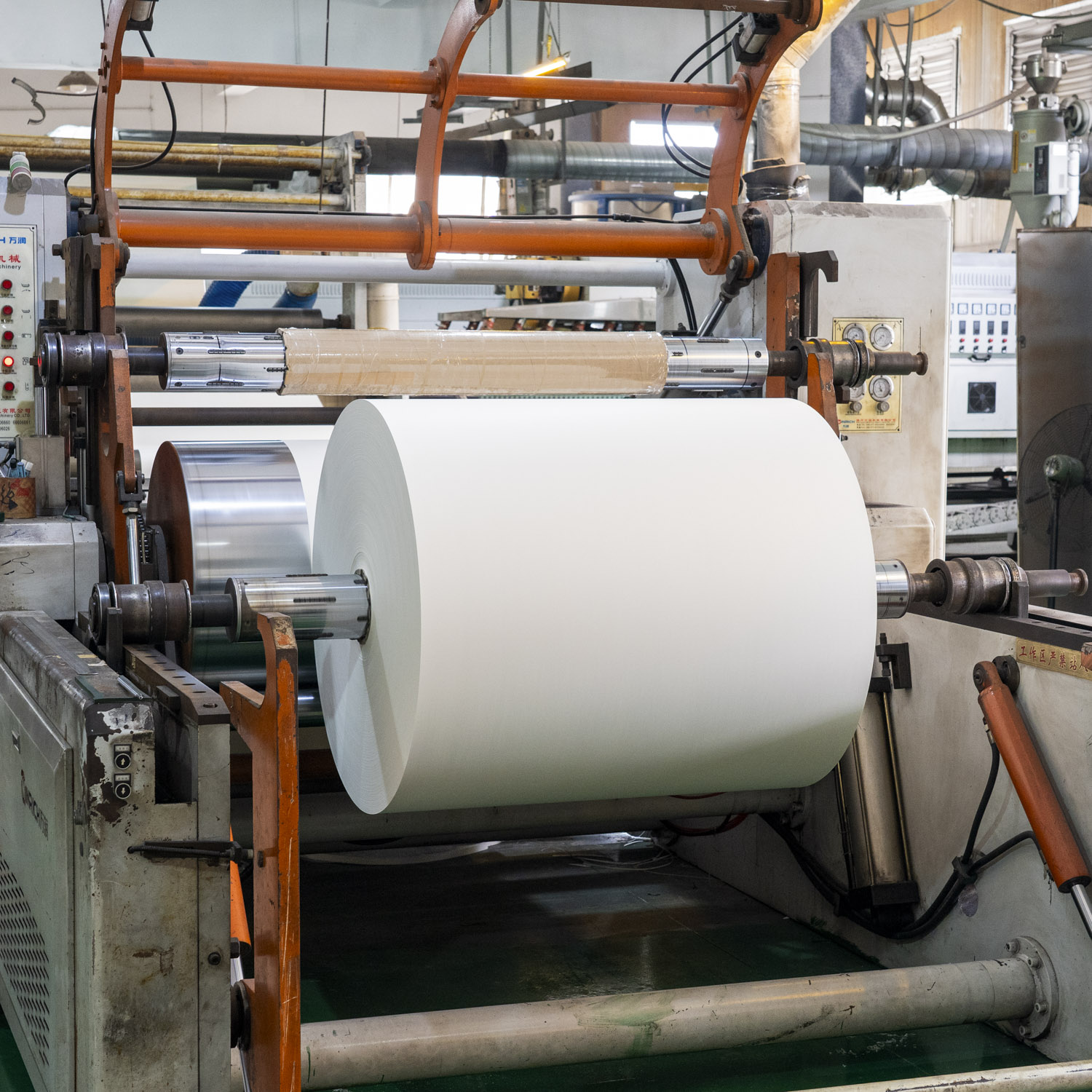 Paper roll processing equipment at food packaging production partner
